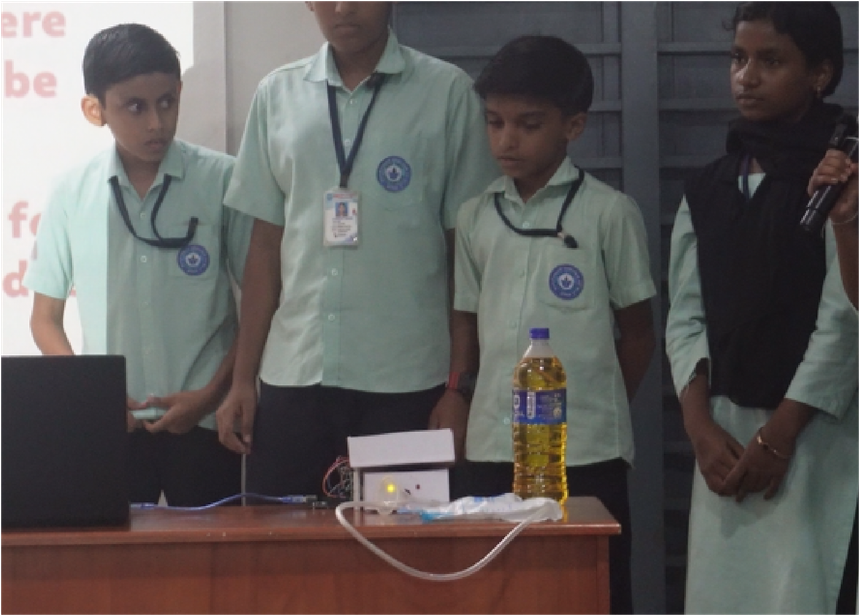 Students presenting a robotics project at the district expo