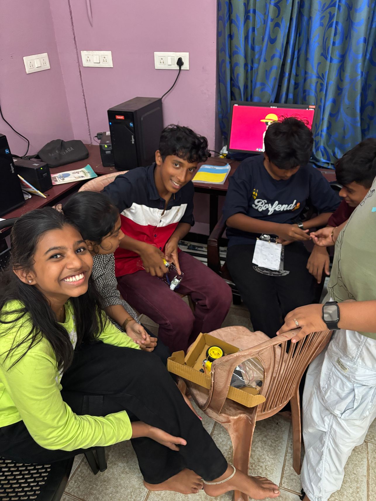 Students building their robotics project together