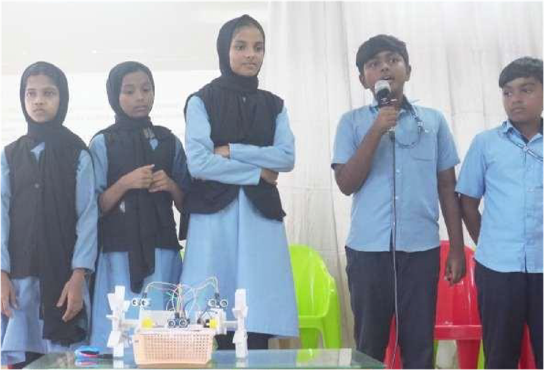 Students presenting the Waste-Collecting River Boat